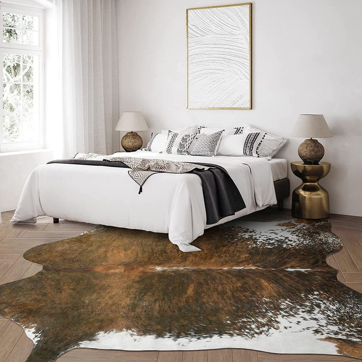 Classic brown and white cowhide rug in a bedroom with gold and copper details