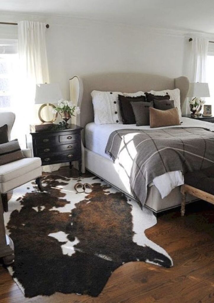 Cowhide Rug in soft toned bedroom