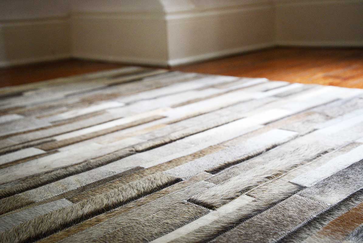 Gray, Beige and White Patchwork Cowhide Rug Stripes Design