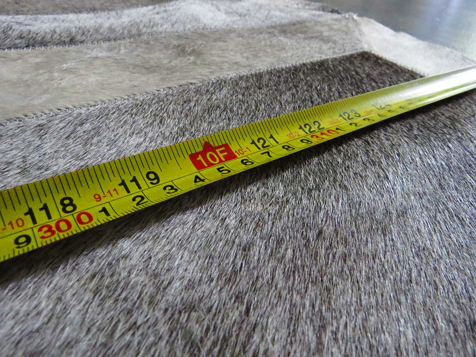 measuring a patchwork cowhide rug