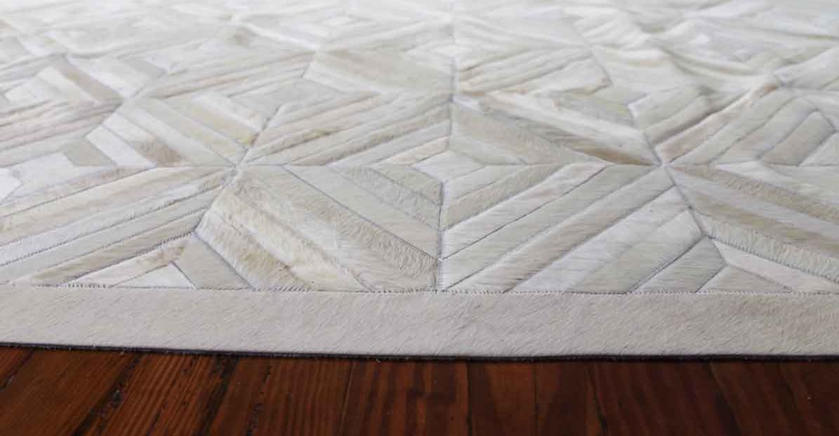 Flat and relaxed white Diamond patchwork cowhide rug