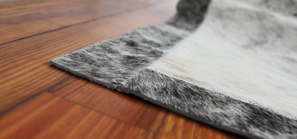 Brindle gray patchwork cowhide rug border
