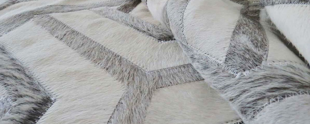 The Amazing Toto Patchwork Cowhide Rug in Taupe and Cream