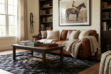 Ralph Lauren styled living room featuring a cowhide are rug in black to beige gradient and leather sofa