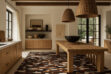 White, brown and black patchwork cowhide rug in stripes, in soft kitchen