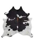 full cowhide rug in white, black and orange on a white background