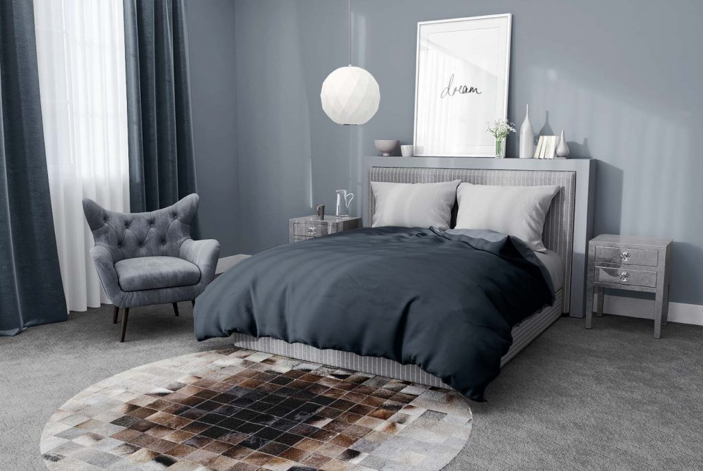 Round Gray and Brown gradient patchwork cowhide rug in bedroom