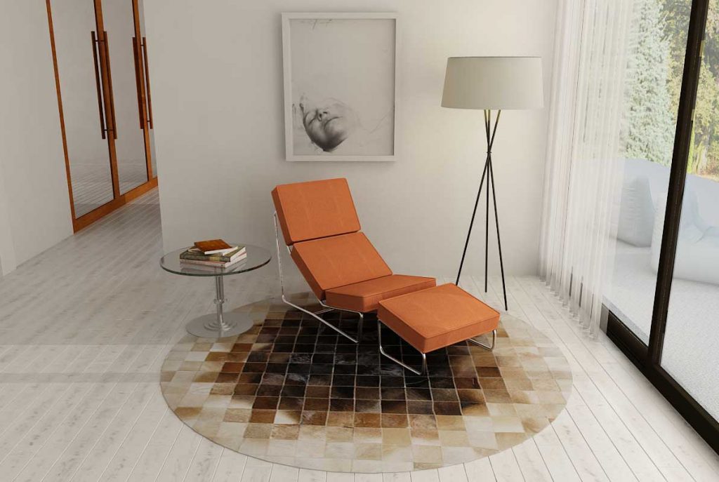 Round Beige and Brown gradient leather area rug with orange chaise lounge