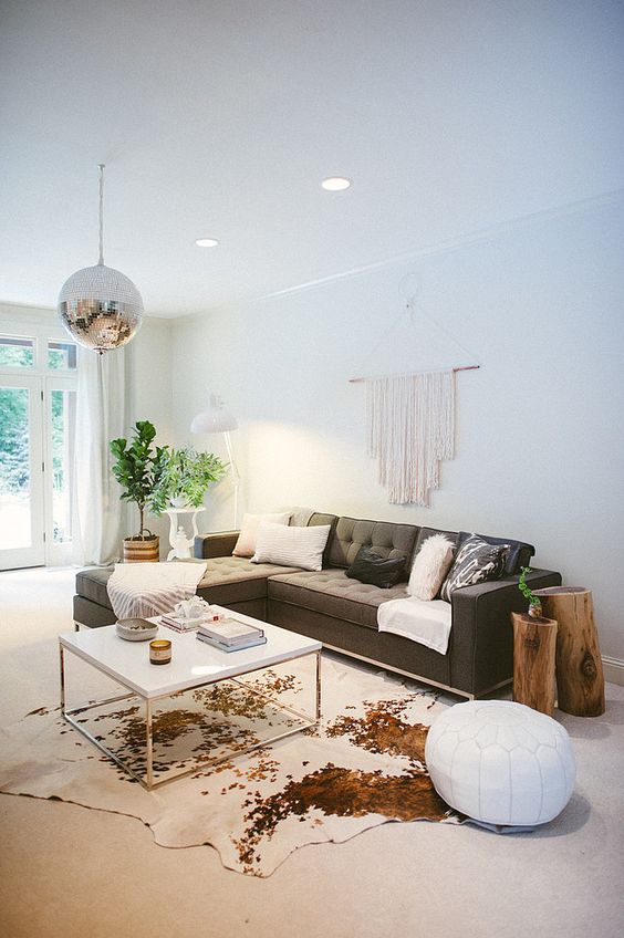 Cowhide area rug in a clear living room