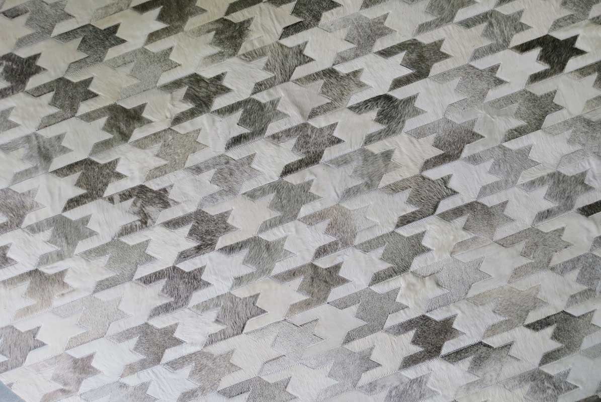 Top view of our Taupe and Cream Houndstooth Patchwork Cowhide Rug
