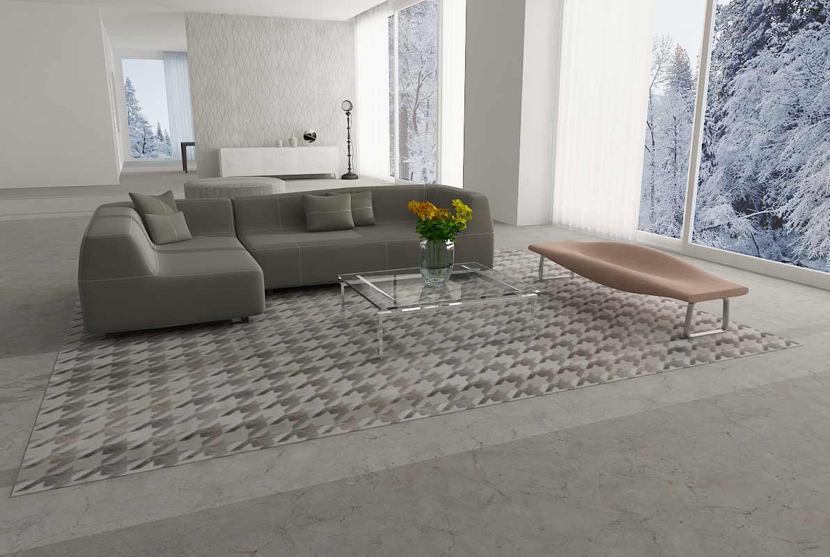 Rectangle Taupe and Cream Houndstooth Patchwork Cowhide Rug on concrete floor