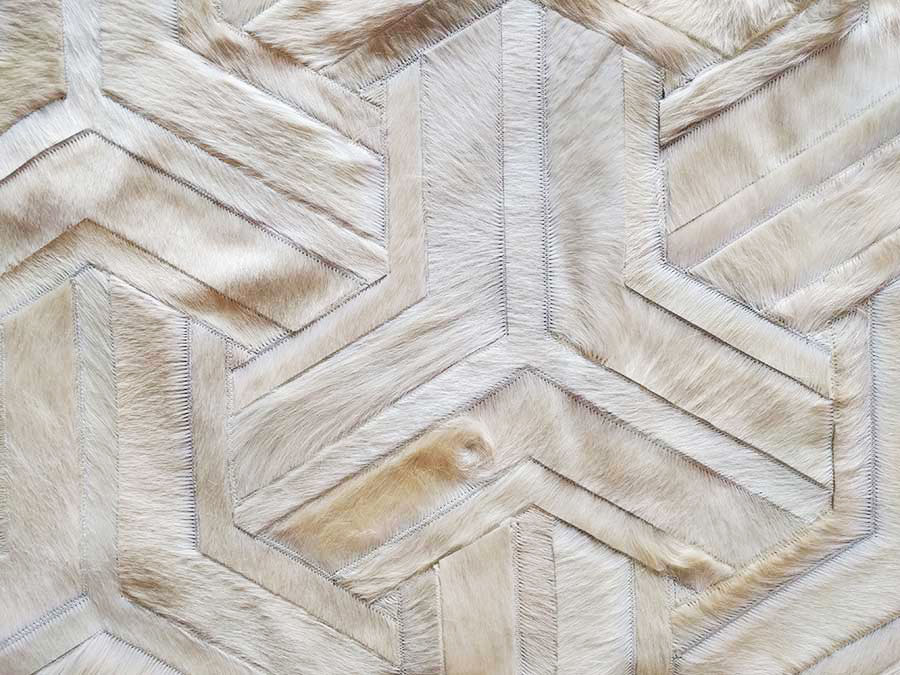 Detail of Bonnie's Toto Cowhide Patchwork Rug in White and Cream Tones
