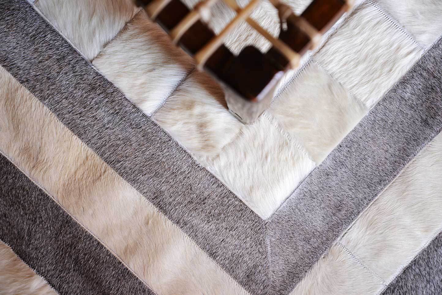 Custom patchwork cowhide rug for Bets in white and gray hair