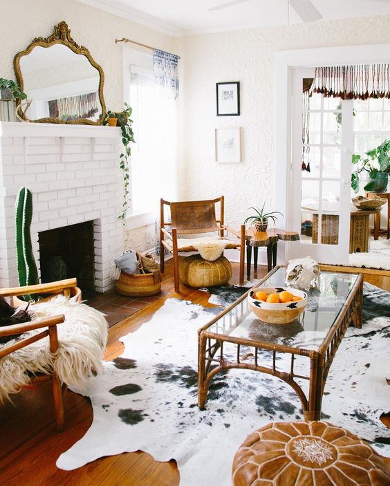 Cowhide rug in a classic, trnaquil living room