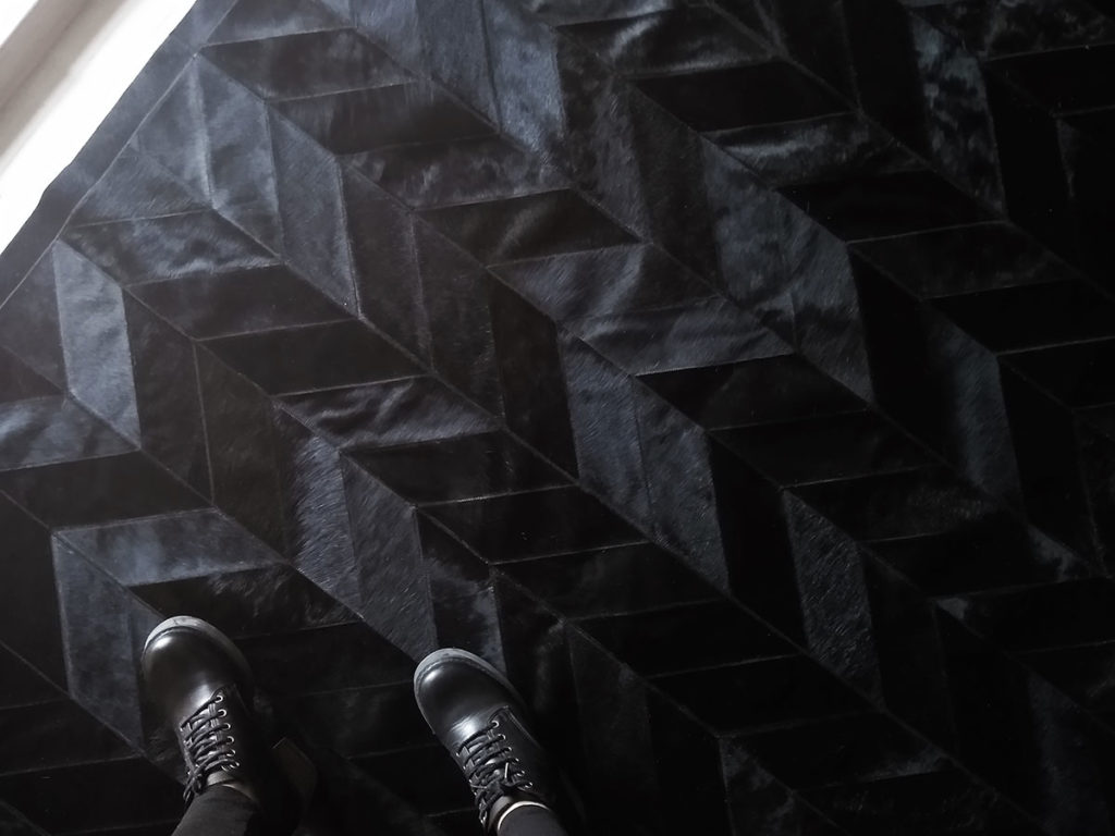 Top view of our Black Chevron Patchwork Cowhide Rug No. 308