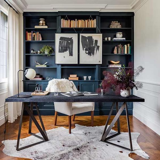 Navy, white and a soft grey cowhide area rug for this lovely home office