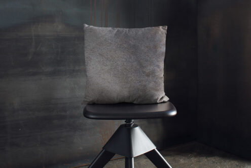 02-taupe-60x60-04 Unique Taupe Gray Cowhide Throw Pillow on Wooden Stool