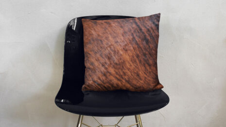 Brown Brindle Cowhide Decorative Pillow on Modern Shiny Chair