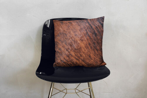 Brown Brindle Cowhide Decorative Pillow on Modern Shiny Chair