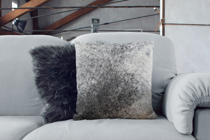 Salt and Pepper Cowhide Throw Pillow on sofa with scandi decor