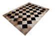 beige and black cowhide patchwork rug in Squares
