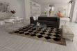 Beige and black cowhide patchwork rug in Squares with modern and minimal furniture
