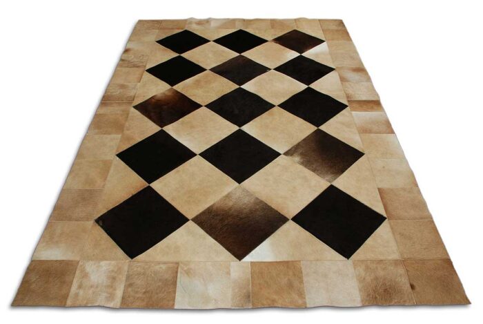 General view of our beige and black cowhide patchwork rug in Squares