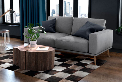 Gray and chocolate brown cowhide patchwork rug in squares with a hair border in living room