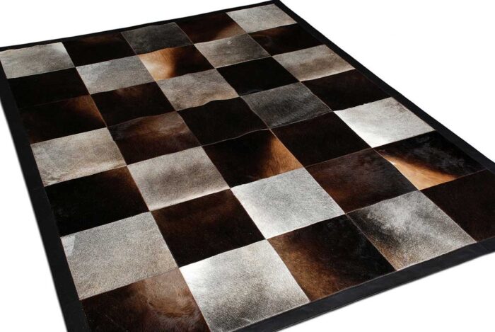 Gray and chocolate brown cowhide patchwork rug in squares with border