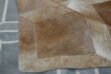 Detail of a Beige Cube patchwork cowhide rug
