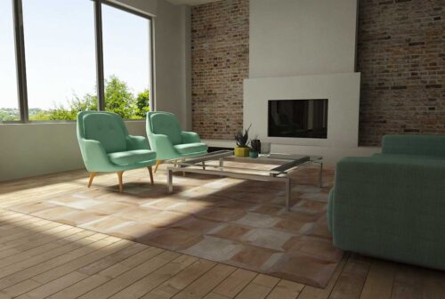 Beige patchwork cowhide rug in the cube design in sunny living room
