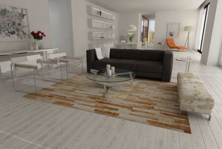 Beige and white patchwork cowhide rug in stripes Beige and white leather area rug in minimal living room