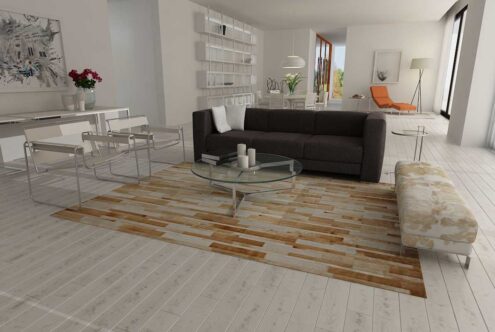 Beige and white patchwork cowhide rug in stripes Beige and white leather area rug in minimal living room