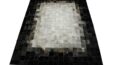 White, gray and black patchwork cowhide rug in squares