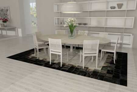 White, gray and black patchwork cowhide rug in dining room White, gray and black patchwork cowhide rug in dining room