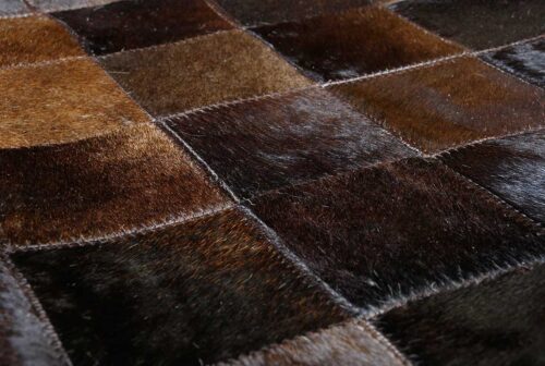Close-up of our Brown and Black Patchwork Cowhide in Rug in Squares