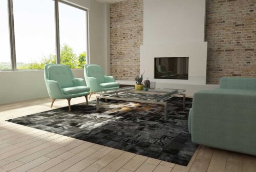 Brown and Black Patchwork Cowhide in Rug in a bright living room with aqua sofas