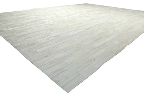 White patchwork cowhide rug in stripes