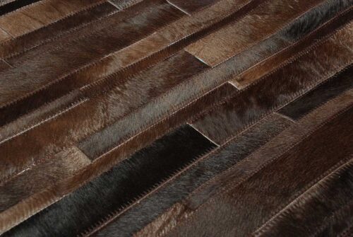 Detail of Patchwork Cowhide Rug in brown stripes