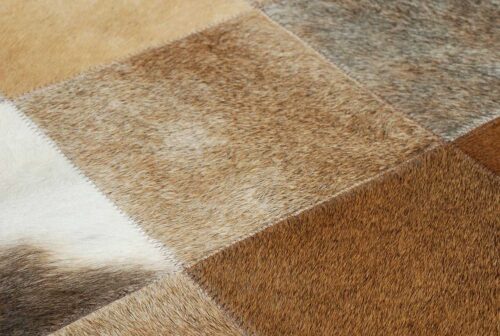 Color detail of a patchwork cowhide rug in mixed browns