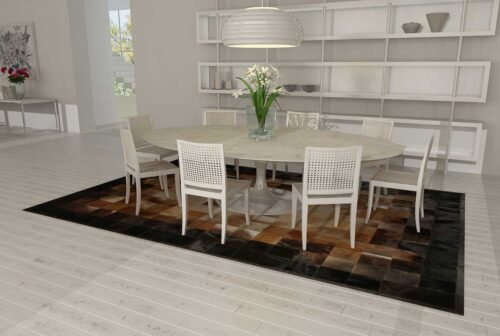 Square tiles brown, beige and black cowhide patchwork rug in a white dining room