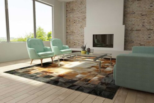 Square tiles brown, beige and black leather area rug in a sunny living room Square tiles brown, beige and black leather area rug in a sunny living room