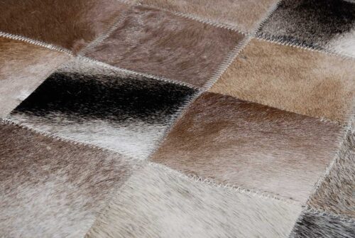 Color zoom in of Grey and Brown gradient patchwork cowhide rug