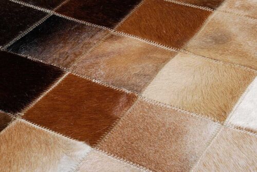 Color zoom in of gradient cowhide patchwork rug