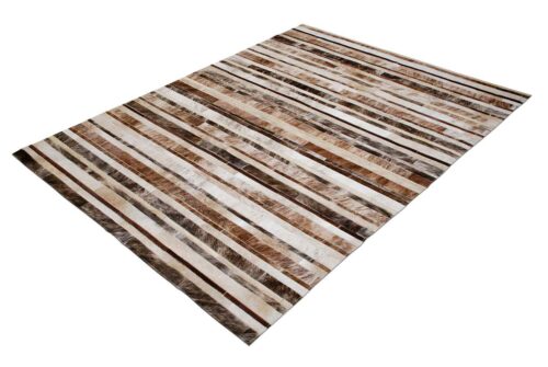 Brindle, brown and white patchwork cowhide rug in a striped design
