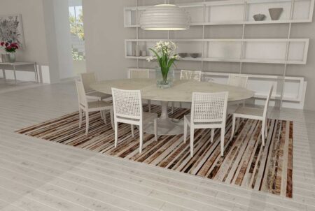 227++++++++++ Brindle, brown and white patchwork cowhide rug in a striped design in a white dining room