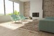 Brindle, brown and white patchwork cowhide rug in a striped design in a sunny living room