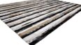 Striped beige and black and white cowhide patchwork rug
