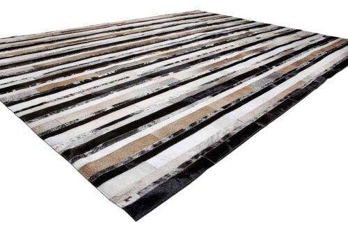 Striped beige and black and white cowhide patchwork rug
