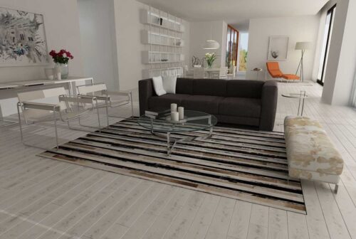 Stripes beige and black and white patchwork cowhide rug in an open living room
